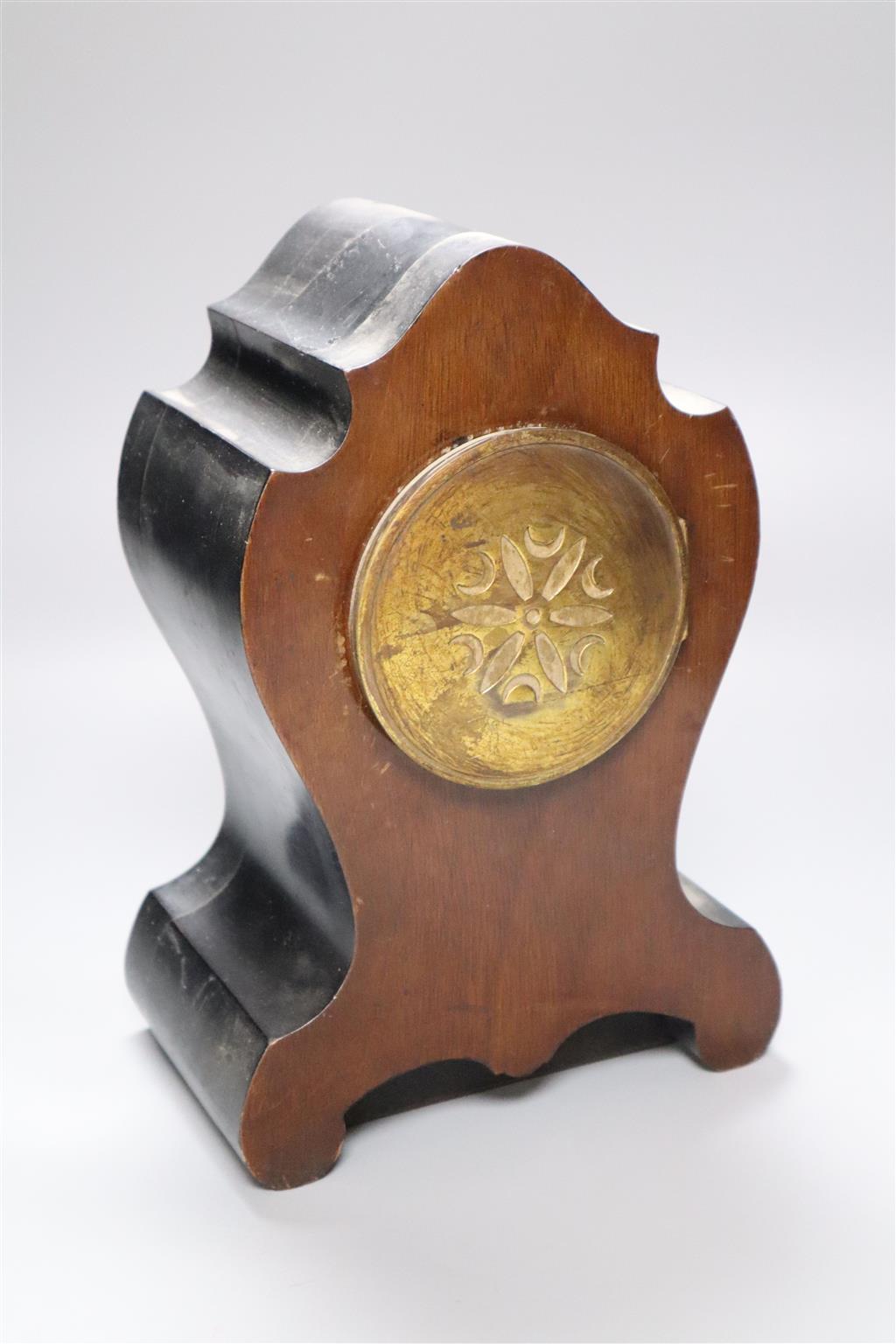 A 19th century French inlaid mantel clock with enamelled numerals, countwheel striking on a bell, 26cm
